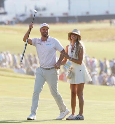 Wyndham Clark celebrates with his girlfriend Emily Tanner after winning the 126th U.S. Open Golf Championship at Shinnecock Hills Golf Club in Southampton, NY, on Sunday, June 21, 2026. Clark won with a four-under-par score of 276.  NYC202606213004 JOHNxANGELILLO