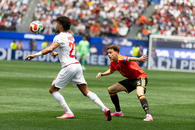 June 21, 2026, Los Angeles, California, USA: IR Iran Ramin Rezaeian (23) in actions against Belgium Maxim De Cuyper (5) during the FIFA World Cup, WM, Weltmeisterschaft, Fussball Group G soccer match at SoFi Stadium in Inglewood, Calif., Sunday, June 21, 2026. Los Angeles USA - ZUMAc68_ 20260621_zaf_c68_073 Copyright: xRingoxChiux