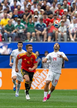 June 21, 2026, Inglewood, California, USA: Iranian DODI LUKEBAKIO (right) and BelgiumÃ¢â‚¬â ¢s BRANDON MECHELE chase the ball in a World Cup 2026 match that ended in a 0-0 draw at Los Angeles Stadium. WORLD CUP 2026 BELGIUM 0:0 IRAN  - ZUMAh234 20260621_zsp_h234_013 Copyright: xMarkxEdwardxHarrisx