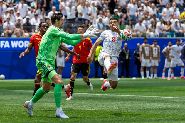 June 21, 2026, Los Angeles, California, United States: Belgium goalkeeper Thibaut Courtois (1) and IR Iran Mehdi Taremi (9) seen in action during the FIFA World Cup, WM, Weltmeisterschaft, Fussball Group G soccer match between IR Iran and Belgium at SoFi Stadium. Final score; IR Iran 0:0 Belgium IR Iran Vs Belgium In Los Angeles, USA - 21 Jun 2026  - ZUMAs197 20260621_aaa_s197_300 Copyright: xRingoxChiux