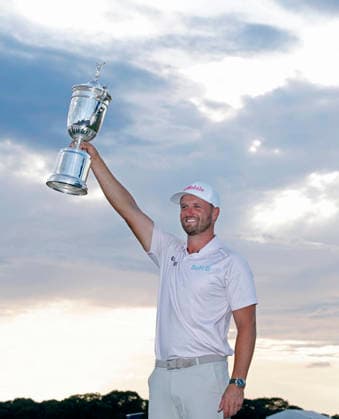 Wyndham Clark holds the championship trophy after winning the 126th U.S. Open Golf Championship at Shinnecock Hills Golf Club in Southampton, NY, on Sunday, June 21, 2026. Clark won with a four-under-par score of 276.  NYC202606213015 JOHNxANGELILLO