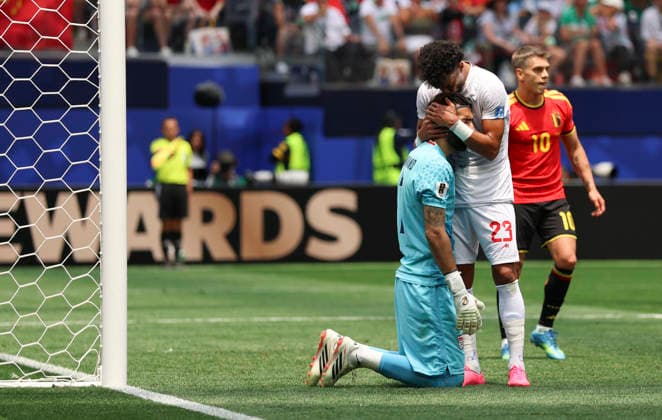 (260622) -- LOS ANGELES, June 22, 2026 -- Ramin Rezaeian (C) of Iran hugs his teammate goalkeeper Alireza Beiranvand (L) during a group G match between Belgium and Iran at the 2026 FIFA World Cup, WM, Weltmeisterschaft, Fussball at Los Angeles Stadium in Los Angeles, the United States, June 21, 2026. ) (SP)U.S.-LOS ANGELES-FOOTBALL-FIFA WORLD CUP-GROUP G-BEL VS IRN BaixXuefei 