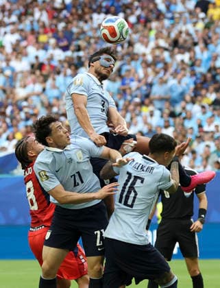 (260622) -- MIAMI, June 22, 2026 -- Sebastian Caceres (top) of Uruguay fights for a head ball during the group H match between Uruguay and Cape Verde at the 2026 FIFA World Cup, WM, Weltmeisterschaft, Fussball at Miami Stadium, Miami, the United States, June 21, 2026. ) (SP)U.S.-MIAMI-FOOTBALL-FIFA WORLD CUP-GROUP H-URU VS CPV ZhangxChen 