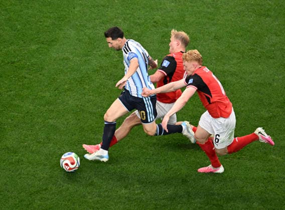 (260623) -- DALLAS, June 23, 2026 -- Lionel Messi (L) of Argentina breaks through during the group J match between Argentina and Austria at the 2026 FIFA World Cup, WM, Weltmeisterschaft, Fussball at Dallas Stadium in Dallas, the United States, June 22, 2026. ) (SP)U.S.-DALLAS-FOOTBALL-FIFA WORLD CUP-GROUP J-ARG VS AUT WuxXiaoling 