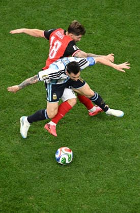(260623) -- DALLAS, June 23, 2026 -- Lionel Messi (bottom) of Argentina vies with Romano Schmid of Austria during the group J match between Argentina and Austria at the 2026 FIFA World Cup, WM, Weltmeisterschaft, Fussball at Dallas Stadium in Dallas, the United States, June 22, 2026. ) (SP)U.S.-DALLAS-FOOTBALL-FIFA WORLD CUP-GROUP J-ARG VS AUT WuxXiaoling 