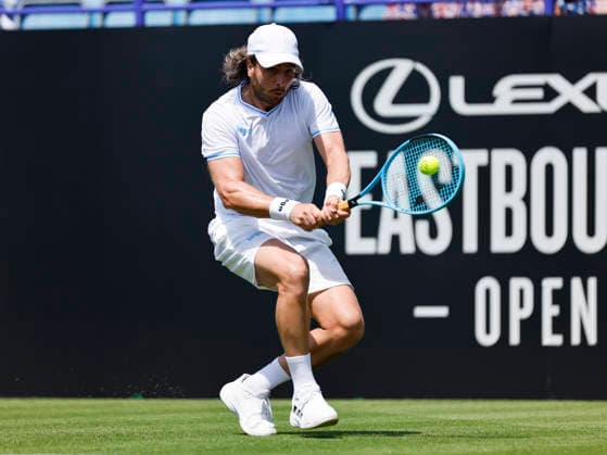 RECORD DATE NOT STATED 22nd June 2026; Devonshire Park Lawn Tennis Club, Eastbourne, East Sussex, England; Lexus Eastbourne Open Tennis, Day Three; Camilo Ugo Carabelli (ARG) plays a backhand shot against Jack Pinnington Jones (GBR) HongboxChen