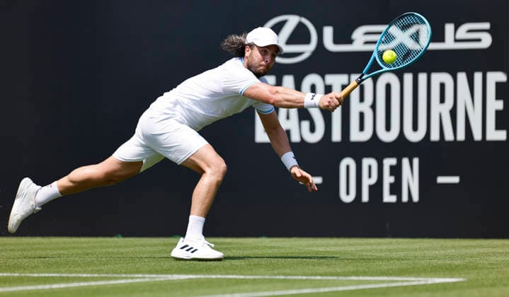 RECORD DATE NOT STATED 22nd June 2026; Devonshire Park Lawn Tennis Club, Eastbourne, East Sussex, England; Lexus Eastbourne Open Tennis, Day Three; Camilo Ugo Carabelli (ARG) plays a backhand shot against Jack Pinnington Jones (GBR) HongboxChen