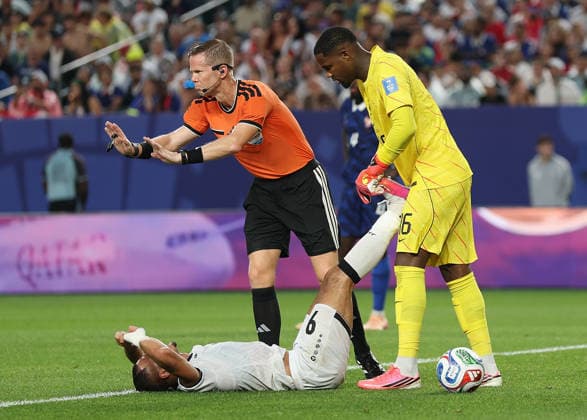 (260623) -- PHILADELPHIA, June 23, 2026 -- France s goalkeeper Mike Maignan (R) helps stretch Ali Al-Hamadi (L) of Iraq during the group I match between France and Iraq at the 2026 FIFA World Cup, WM, Weltmeisterschaft, Fussball at Philadelphia Stadium in Philadelphia, the United States, June 22, 2026. ) (SP)U.S.-PHILADELPHIA-FOOTBALL-FIFA WORLD CUP-GROUP I-FRA VS IRQ HuxXingyu 