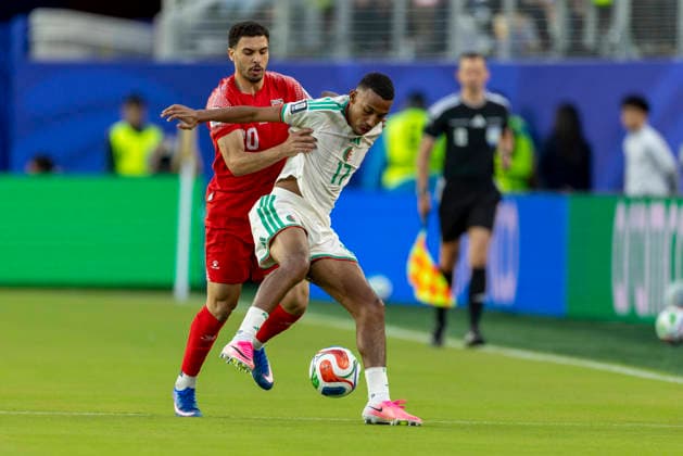 SANTA CLARA, CA - JUNE 22: Mohannad Abu Taha 20 of Jordan and Rafik Belghali 17 of Algeria fight for the ball during the FIFA World Cup, WM, Weltmeisterschaft, Fussball Group J match between Jordan and Algeria on June 22, 2026 at San Francisco Bay Area Stadium in Santa Clara, CA. (Photo by Bob Kupbens Icon Sportswire) SOCCER: JUN 22 FIFA World Cup 26 Group J - Jordan vs Algeria EDITORIAL USE ONLY Icon260622012
