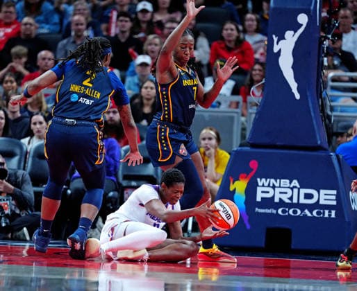 INDIANAPOLIS, IN - JUNE 22: Phoenix Mercury forward Valeriane Ayayi (11) falls to the ground while guarded by Indiana Fever center Aliyah Boston (7) on June 22, 2026, at Gainbridge Fieldhouse in Indianapolis, Indiana. (Photo by Brian Spurlock Icon Sportswire) WNBA, Basketball Damen, USA JUN 22 Phoenix Mercury at Indiana Fever EDITORIAL USE ONLY Icon26062299