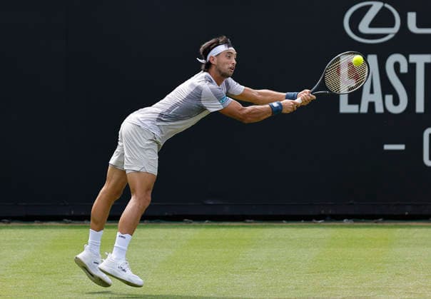 RECORD DATE NOT STATED 23rd June 2026; Devonshire Park Lawn Tennis Club, Eastbourne, East Sussex, England; Lexus Eastbourne Open Tennis, Day Three; Thiago Agustin Tirante (ARG) plays a backhand shot against Hamish Stewart (GBR) HongboxChen