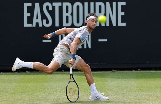 RECORD DATE NOT STATED 23rd June 2026; Devonshire Park Lawn Tennis Club, Eastbourne, East Sussex, England; Lexus Eastbourne Open Tennis, Day Three; Thiago Agustin Tirante (ARG) plays a backhand shot against Hamish Stewart (GBR) HongboxChen