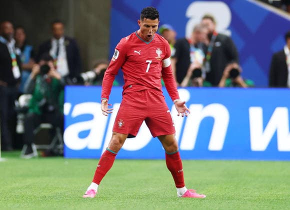 Portugal s Cristiano Ronaldo celebrates after scoring a goal against Uzbekistan in the first half of a FIFA World Cup, WM, Weltmeisterschaft, Fussball match at Houston Stadium in Houston, Texas, on Tuesday, June 23, 2026.  HOU20260623910 CHRISTIANxBRUNSKILL