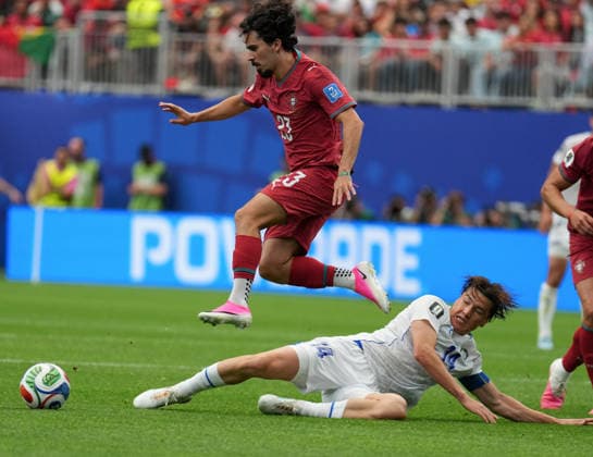 (260624) -- HOUSTON, June 24, 2026 -- Vitinha (up) of Portugal competes during the group K match between Portugal and Uzbekistan at the 2026 FIFA World Cup, WM, Weltmeisterschaft, Fussball at Houston Stadium in Houston, the United States, June 23, 2026. ) (SP)U.S.-HOUSTON-FOOTBALL-FIFA WORLD CUP-GROUP K-POR VS UZB XiaoxYijiu 