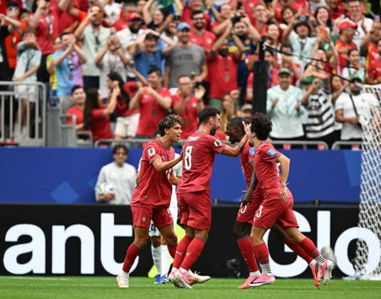 (260624) -- HOUSTON, June 24, 2026 -- Players of Portugal celebrate scoring during the group K match between Portugal and Uzbekistan at the 2026 FIFA World Cup, WM, Weltmeisterschaft, Fussball at Houston Stadium in Houston, the United States, June 23, 2026. ) (SP)U.S.-HOUSTON-FOOTBALL-FIFA WORLD CUP-GROUP K-POR VS UZB XiaoxYijiu 