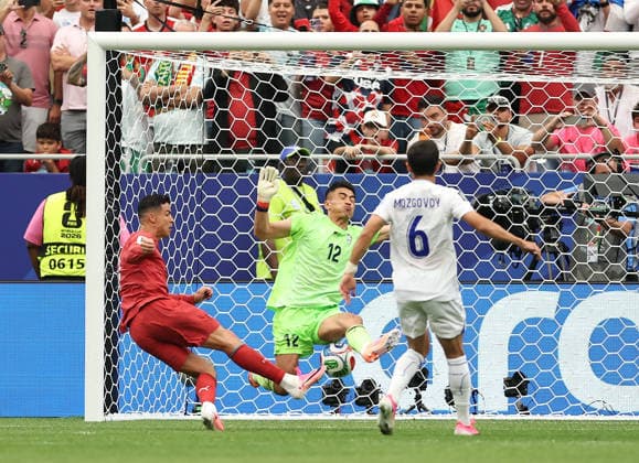(260624) -- HOUSTON, June 24, 2026 -- Abduvohid Nematov (C), goalkeeper of Uzbekistan, makes a save during the group K match between Portugal and Uzbekistan at the 2026 FIFA World Cup, WM, Weltmeisterschaft, Fussball at Houston Stadium in Houston, the United States, June 23, 2026. ) (SP)U.S.-HOUSTON-FOOTBALL-FIFA WORLD CUP-GROUP K-POR VS UZB LixMing 