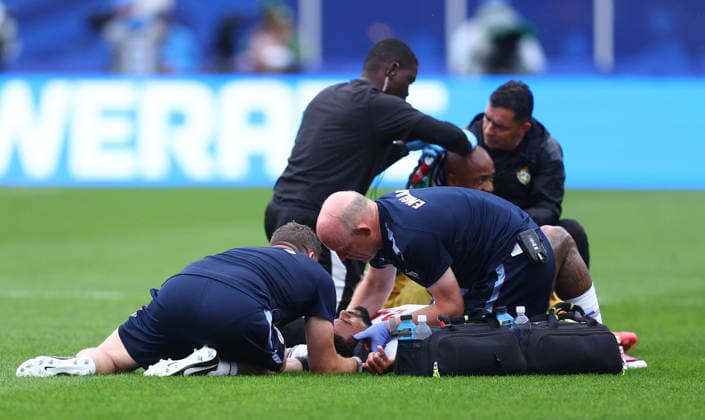 Foxborough, USA, 23rd June 2026. James Reece of England is examined by medical staff after clashing heads with Jordan Ayew of Ghana during the England vs Ghana FIFA World Cup, WM, Weltmeisterschaft, Fussball match at Gillette Stadium, Foxborough. Picture credit should read: Paul Terry Sportimage EDITORIAL USE ONLY. No use with unauthorised audio, video, data, fixture lists, club league logos or live services. Online in-match use limited to 120 images, no video emulation. No use in betting, games or single club league player publications. SPI_052_PT_Eng_Ghana SPI-4840-0055