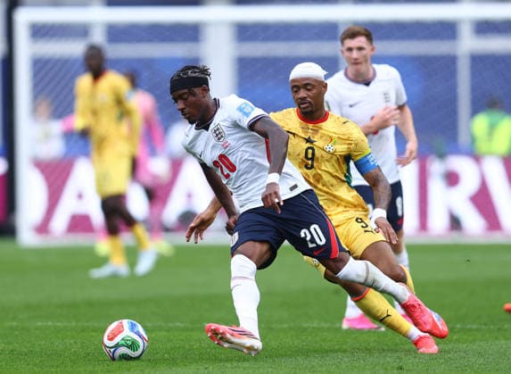 Foxborough, USA, 23rd June 2026. Noni Madueke of England tussles with Jordan Ayew of Ghana during the England vs Ghana FIFA World Cup, WM, Weltmeisterschaft, Fussball match at Gillette Stadium, Foxborough. Picture credit should read: Paul Terry Sportimage EDITORIAL USE ONLY. No use with unauthorised audio, video, data, fixture lists, club league logos or live services. Online in-match use limited to 120 images, no video emulation. No use in betting, games or single club league player publications. SPI_067_PT_Eng_Ghana SPI-4840-0073