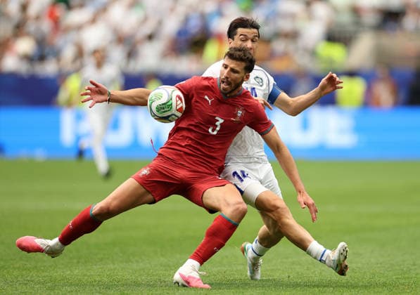 (260624) -- HOUSTON, June 24, 2026 -- Ruben Dias (front) of Portugal competes with Eldor Shomurodov of Uzbekistan during the group K match between Portugal and Uzbekistan at the 2026 FIFA World Cup, WM, Weltmeisterschaft, Fussball at Houston Stadium in Houston, the United States, June 23, 2026. ) (SP)U.S.-HOUSTON-FOOTBALL-FIFA WORLD CUP-GROUP K-POR VS UZB LixMing 