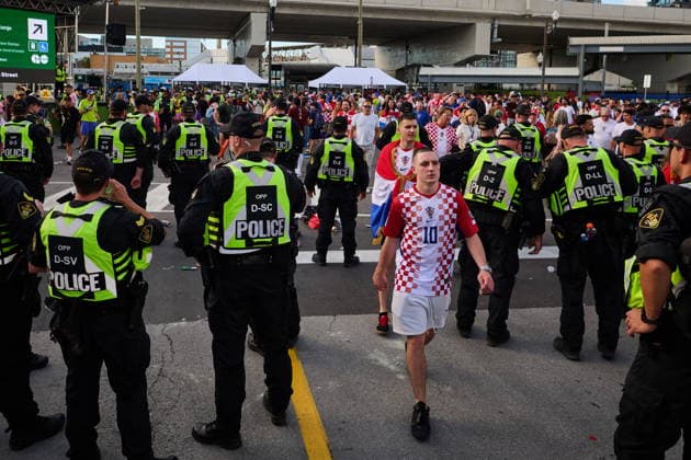 June 23, 2026, Toronto, On, Canada: Croatia fans pass by police as as they approach Toronto Stadium before a FIFA World Cup, WM, Weltmeisterschaft, Fussball group-stage soccer match against Panama in Toronto, on Tuesday, June 23, 2026. Canada News - June 23, 2026  - ZUMAc35_ 20260623_zaf_c35_134 Copyright: xSammyxKoganx