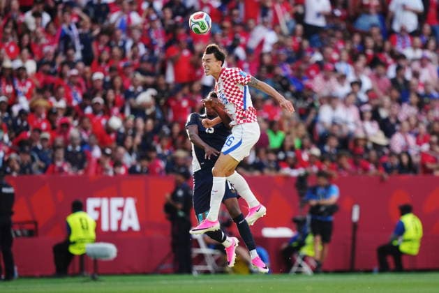 June 23, 2026, Toronto, On, CANADA: Croatia s Petar Musa (26) heads the ball over Panama s Jiovany Ramos (13) during the first half of a World Cup Group L soccer match, in Toronto, on Tuesday, June 23, 2026. Canada News - June 23, 2026  - ZUMAc35_ 20260623_zaf_c35_175 Copyright: xNathanxDenettex