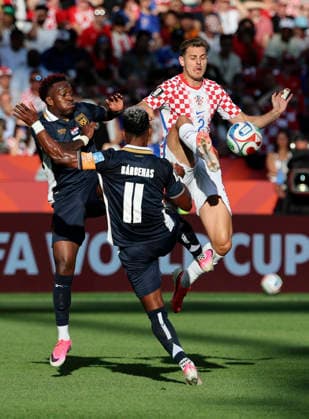 (260624) -- TORONTO, June 24, 2026 -- Josip Stanisic (R) of Croatia vies with Jose Luis Rodriguez (L) of Panama during the group L match between Croatia and Panama at the 2026 FIFA World Cup, WM, Weltmeisterschaft, Fussball at Toronto Stadium in Toronto, Canada, on June 23, 2026. (Photo by Xinhua) (SP)CANADA-TORONTO-FOOTBALL-FIFA WORLD CUP-GROUP L-CRO VS PAN ZouxZheng 
