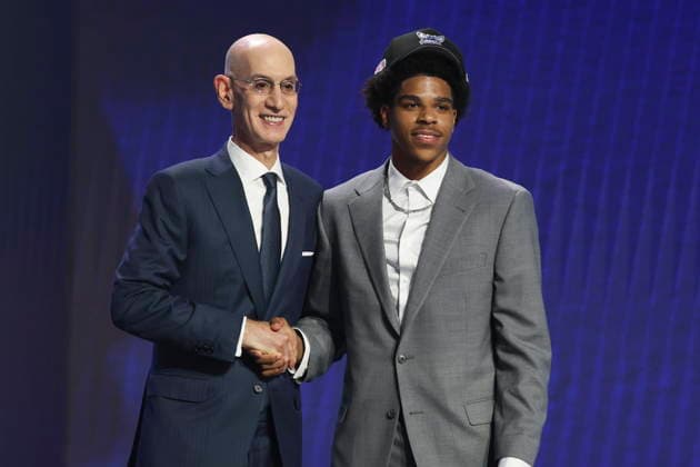 NBA, Basketball Herren, USA Draft round one at Barclays Center NBA commissioner Adam Silver (L) and American basketball player Christian Anderson pose for a picture after he was drafted by the Charlotte Hornets during the first round of the 2026 NBA Draft at the Barclays Center in the Brooklyn borough of New York, New York, USA, 23 June 2026. NEW YORK NEW YORK United States  Copyright: xSARAHxYENESELx