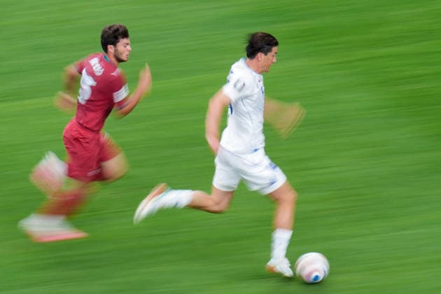 Eldor Shomurodov of Uzbekistan (R) runs with the ball under pressure from Joao Neves of Portugal (L) during a FIFA Men’s World Cup 2026 Group Stage football match between Portugal and Uzbekistan at Houston Stadium, in Houston on June 23th 2026 (Photo by Alexandra Fechete SPP)  Copyright: xAlexandraxFechete SPPx Sportspressphoto_SPR174375
