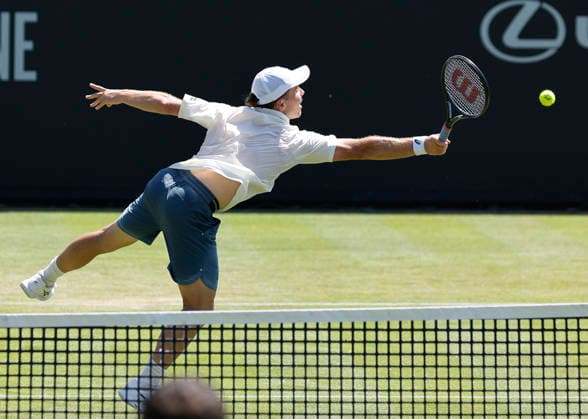 RECORD DATE NOT STATED 24th June 2026; Devonshire Park Lawn Tennis Club, Eastbourne, East Sussex, England; Lexus Eastbourne Open Tennis, Day Four; Arthur Fery (GBR) plays a backhand shot against Juan Manuel Cerundoli (ARG) HongboxChen