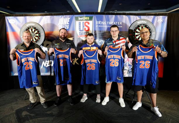 James Wade of England, Alex Spellman, Josh Rock of Northern Ireland, Gian van Veen of Netherlands and Adam Sevada hold New York Knicks jerseys for a photo op on the eve of the bet365 US Darts Masters in The Infosys Theater at Madison Square Garden on Wednesday, June 24, 2026 in New York City.  NYP20260624120 JOHNxANGELILLO