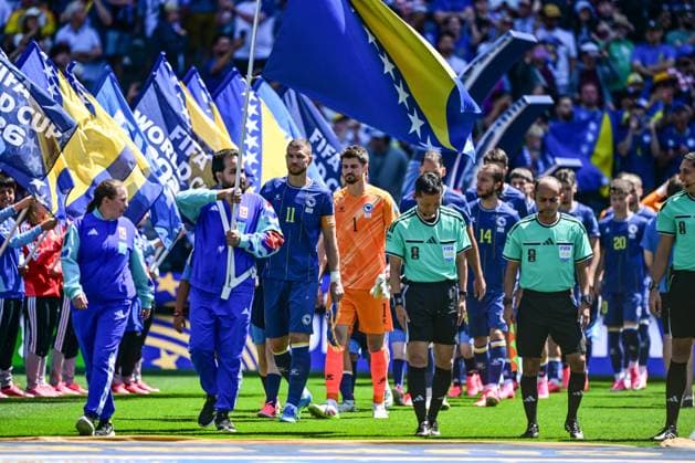Bosnia and Herzegovina s Stjepan Radeljic and Bosnia and Herzegovina s goalkeeper Nikola Vasilj pictured at the start of a soccer game between Bosnia and Herzegovina and Qatar, on Wednesday 24 June 2026 in Seattle, the third and last day in the group stage, in group B of the FIFA World Cup, WM, Weltmeisterschaft, Fussball 2026 in the United States of America. DIRKxWAEM  x179156438x