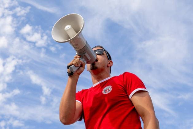 June 24, 2026, Vancouver, Bc, CANADA: A Switzerland supporter yells into a microphone as he leads a group of fans as they march toward B.C. Place before a World Cup Group B soccer match against Canada, in Vancouver, on Wednesday, June 24, 2026. Canada News - June 24, 2026  - ZUMAc35_ 20260624_zaf_c35_055 Copyright: xTimothyxMatweyx