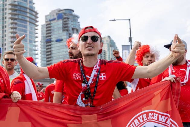 June 24, 2026, Vancouver, Bc, CANADA: Switzerland fans march toward B.C. Place before a World Cup Group B soccer match against Canada, in Vancouver, on Wednesday, June 24, 2026. Canada News - June 24, 2026  - ZUMAc35_ 20260624_zaf_c35_056 Copyright: xTimothyxMatweyx