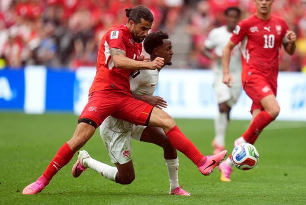 FIFA World Cup, WM, Weltmeisterschaft, Fussball 2026 - Group B - Switzerland vs Canada Ricardo Rodriguez of Switzerland (L) and Ali Ahmed of Canada in action during the FIFA World Cup 2026 group stage match Switzerland against Canada, in Vancouver, Canada, 24 June 2026. VANCOUVER Canada  Copyright: xBOBxFRIDx