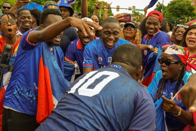 June 24, 2026, Atlanta, Georgia, United States of America: Haiti fans celebrating in a circle during the Haiti fan march before the Morocco vs Haiti First Stage Group C match in ATLANTA, Georgia. Atlanta United States of America - ZUMAg276 20260624_zsp_g276_014 Copyright: xMalachixGabrielx