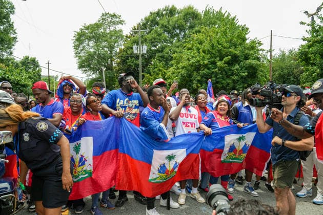 June 24, 2026, Atlanta, Georgia, United States of America: Haiti fans holding up the Haitian flag poses for the cameras before the Haiti fan march before the Morocco vs Haiti First Stage Group C match in ATLANTA, Georgia. World Cup 2026: Group C: Morocco : Haiti  - ZUMAg276 20260624_zsp_g276_002 Copyright: xMalachixGabrielx