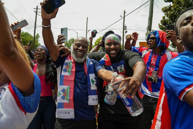 June 24, 2026, Atlanta, Georgia, United States of America: Two Haiti fans poses for the camera during the Haiti fan march before the Morocco vs Haiti First Stage Group C match in ATLANTA, Georgia. Atlanta United States of America - ZUMAg276 20260624_zsp_g276_020 Copyright: xMalachixGabrielx