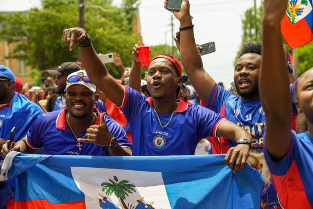 June 24, 2026, Atlanta, Georgia, United States of America: Haiti fans holding up the Haitian flag for the cameras during the Haiti fan march before the Morocco vs Haiti First Stage Group C match in ATLANTA, Georgia. Atlanta United States of America - ZUMAg276 20260624_zsp_g276_021 Copyright: xMalachixGabrielx
