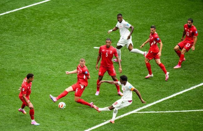 Switzerland v Canada - FIFA World Cup, WM, Weltmeisterschaft, Fussball 2026 - Group B VANCOUVER, CANADA - JUNE 24: Nico Elvedi (4) of Switzerland in action against Jonathan David (10) of Canada during the 2026 FIFA World Cup Group B match between Switzerland and Canada at BC Place Stadium in Vancouver, Canada, on June 24, 2026. Ercin Erturk Anadolu Vancouver Canada. Editorial use only. Please get in touch for any other usage.  Copyright: x2026xAnadoluxErcinxErturkx