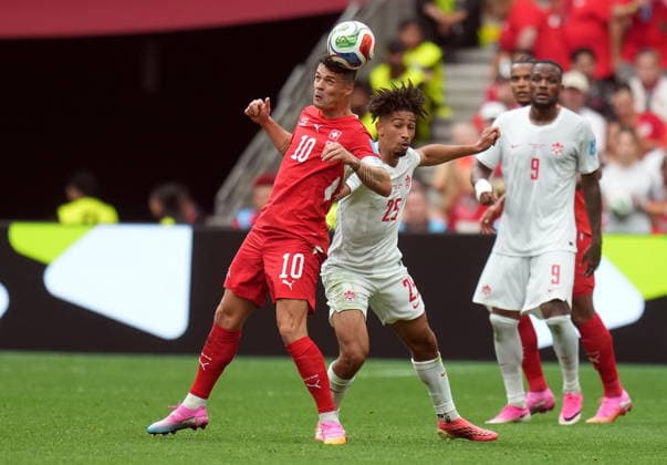 FIFA World Cup, WM, Weltmeisterschaft, Fussball 2026 - Group B - Switzerland vs Canada Granit Xhaka of Switzerland (L) and Nathan Saliba of Canada in action during the FIFA World Cup 2026 group stage match Switzerland against Canada, in Vancouver, Canada, 24 June 2026. VANCOUVER Canada  Copyright: xBOBxFRIDx
