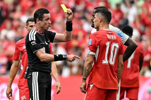 Match referee Ramon Abatti shows a yellow card to Granit Xhaka (captain) of Switzerland, Switzerland v Canada, Group B football match of the FIFA World Cup, WM, Weltmeisterschaft, Fussball 2026 at BC Place, Vancouver, Canada on Wednesday 24 June 2026. Photo: Andrew Cornaga Vancouver Canada Copyright: xAndrewxCornaga x