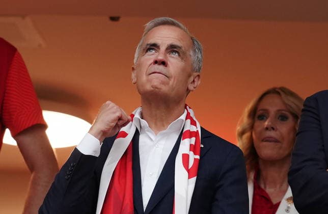 June 24, 2026, Vancouver, Bc, CANADA: Prime Minister Mark Carney cheers as players enter the field prior to the first half of a World Cup Group B soccer match between Canada and Switzerland, in Vancouver, on Wednesday, June 24, 2026. Canada News - June 24, 2026  - ZUMAc35_ 20260624_zaf_c35_095 Copyright: xEthanxCairnsx