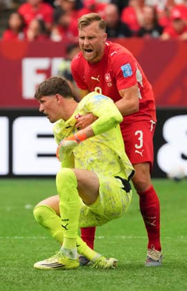 (260625) -- VANCOUVER, June 25, 2026 -- Silvan Widmer (R) of Switzerland pulls up Gregor Kobel, goalkeeper of Switzerland during the group B match between Switzerland and Canada at the 2026 FIFA World Cup, WM, Weltmeisterschaft, Fussball at BC Place Vancouver in Vancouver, Canada, June 24, 2026. ) (SP)CANADA-VANCOUVER-FOOTBALL-FIFA WORLD CUP-GROUP B-SUI VS CAN MengxYongmin 