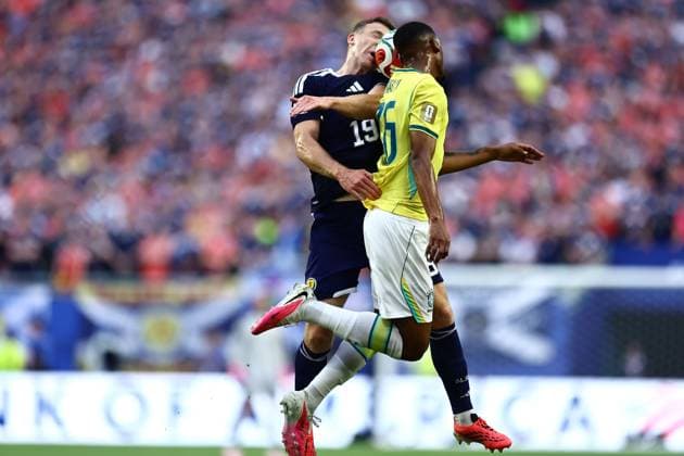Lewis Ferguson of Scotland and Rayan of Brazil Scotland v Brazil, 2026 FIFA World Cup, WM, Weltmeisterschaft, Fussball Group C, Football, Miami Stadium, Miami, Florida, USA - 24 Jun 2026Miami Miami Stadium Florida (FL) United States of America EDITORIAL USE ONLY No use with unauthorised audio, video, data, fixture lists, club league logos or live services. Online in-match use limited to 120 images, no video emulation. No use in betting, games or single club league player publications.  Copyright: xMichaelxZemanek Shutterstockx 16956031af