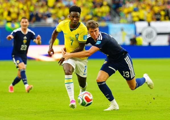 Vinicius Junior of Brazil tackles Jack Hendry of Scotland Scotland v Brazil, 2026 FIFA World Cup, WM, Weltmeisterschaft, Fussball Group C, Football, Miami Stadium, Miami, Florida, USA - 24 Jun 2026Miami Miami Stadium Florida (FL) United States of America EDITORIAL USE ONLY No use with unauthorised audio, video, data, fixture lists, club league logos or live services. Online in-match use limited to 120 images, no video emulation. No use in betting, games or single club league player publications.  Copyright: xJavierxGarcia Shutterstockx 16956030bk