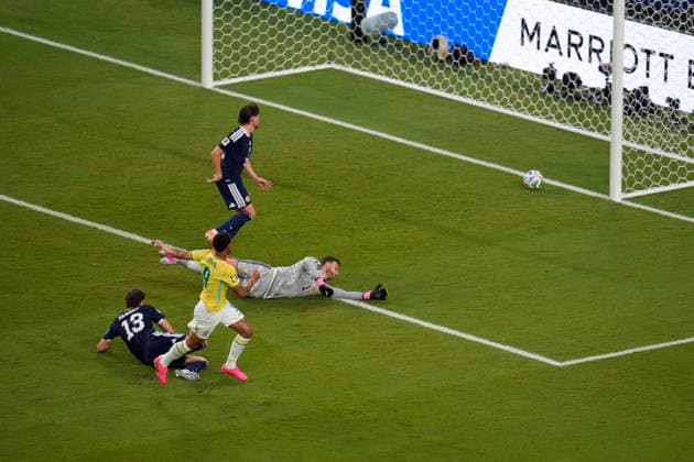 June 24, 2026, Miami Gardens, Florida, USA: Forward Matheus Cunha (9) of Brazil puts the ball past Goalkeeper Angus Gunn (1) of Scotland as he scores the 3rd goal of the game during 2nd half of the World Cup Group C, Round 1 match between Brazil and Scotland at Miami Stadium. Miami Gardens USA - ZUMAd212 20260624_zsp_d212_032 Copyright: xRichardxDolex