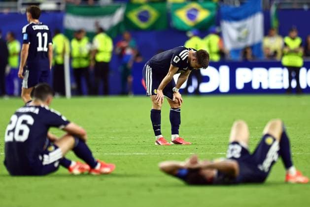 Kieran Tierney and Scotland players dejected at full time Scotland v Brazil, 2026 FIFA World Cup, WM, Weltmeisterschaft, Fussball Group C, Football, Miami Stadium, Miami, Florida, USA - 24 Jun 2026Miami Miami Stadium Florida (FL) United States of America EDITORIAL USE ONLY No use with unauthorised audio, video, data, fixture lists, club league logos or live services. Online in-match use limited to 120 images, no video emulation. No use in betting, games or single club league player publications.  Copyright: xMichaelxZemanek Shutterstockx 16956031ct