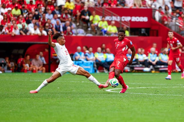 June 24, 2026, Vancouver, British Columbia, Canada: BREEL EMBOLO (7) of Switzerland passes the ball as NATHAN SALIB (25) of Canada tries to pock it away. Canada vs. Switzerland in FIFA World Cup, WM, Weltmeisterschaft, Fussball group stage play held at BC Place Stadium in Vancouver, BC Canada Vancouver Canada - ZUMAk184 20260624_zsp_k184_014 Copyright: xGordonxKalischx