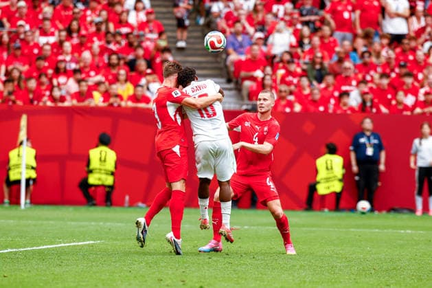 June 24, 2026, Vancouver, British Columbia, Canada: SILVAN WIDMER (3) of Switzerland and JONATHON DAVID (10) of Canada go up for a header. Canada vs. Switzerland in FIFA World Cup, WM, Weltmeisterschaft, Fussball group stage play held at BC Place Stadium in Vancouver, BC Canada 2026 Soccer: Canada 1:2 Switzerland  - ZUMAk184 20260624_zsp_k184_030 Copyright: xGordonxKalischx