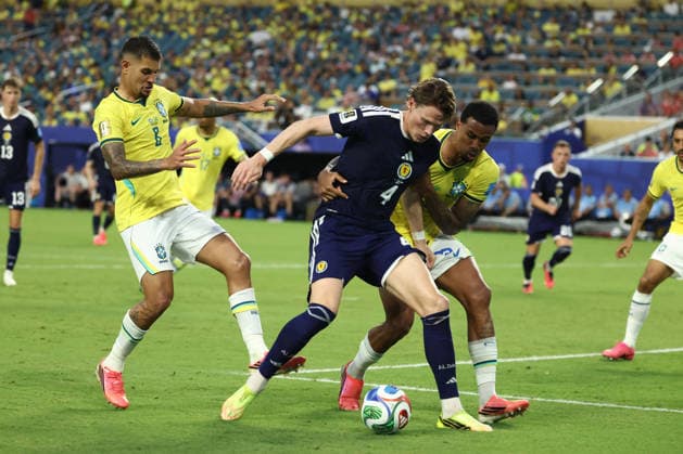MIAMI GARDENS, FL - JUNE 24: Scotland midfielder Scott McTominay (4) tries to keep possession whilst fending off Brazil defender Gabriel (3) and Brazil midfielder Bruno Guimaraes (8) in the second half during the FIFA World Cup, WM, Weltmeisterschaft, Fussball 2026 Group C match between Scotland and Brazil on Wednesday, June 24, 2026 at Miami Stadium in Miami Gardens, FL (Photo by Peter Joneleit Icon Sportswire) SOCCER: JUN 24 FIFA World Cup 26 Group C - Scotland vs Brazil EDITORIAL USE ONLY Icon260624046